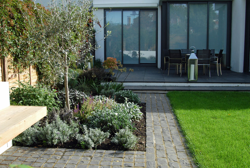 Basalt paving and Mediterranean planting